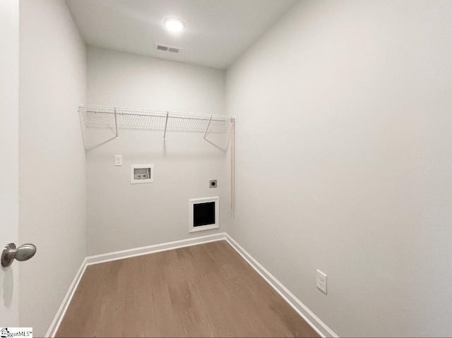 laundry area with visible vents, baseboards, laundry area, hookup for a washing machine, and electric dryer hookup