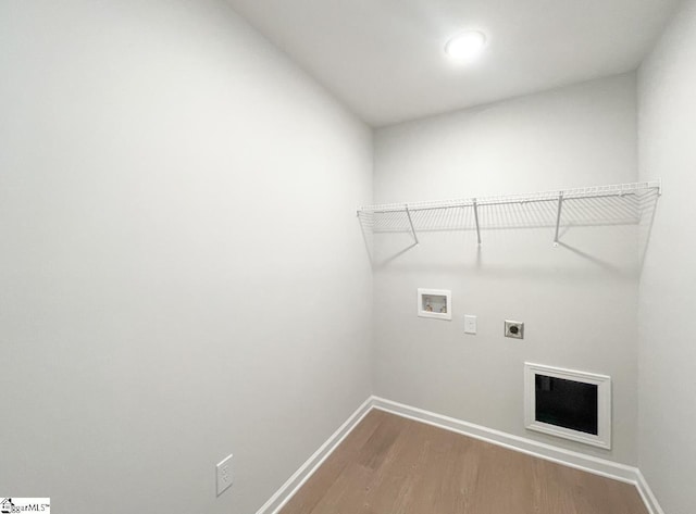 laundry area featuring hookup for a washing machine, hardwood / wood-style floors, and hookup for an electric dryer