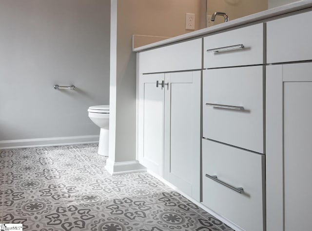 bathroom with tile patterned floors and toilet