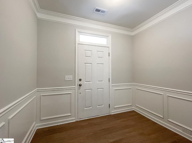 entryway featuring ornamental molding and dark hardwood / wood-style floors