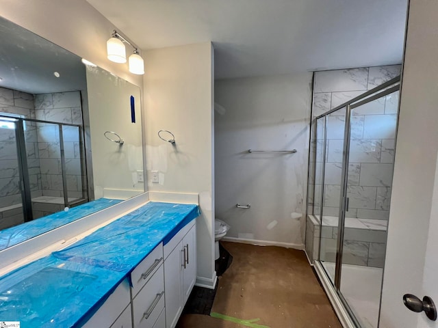 bathroom with walk in shower, toilet, and vanity