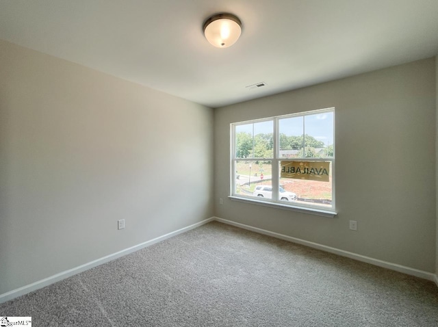 view of carpeted spare room