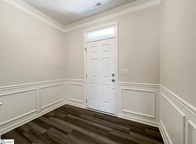 foyer entrance with crown molding and dark hardwood / wood-style flooring