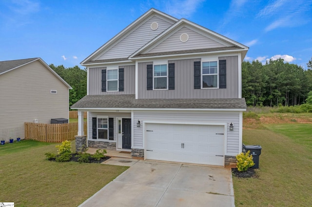 view of front facade with a garage and a front lawn