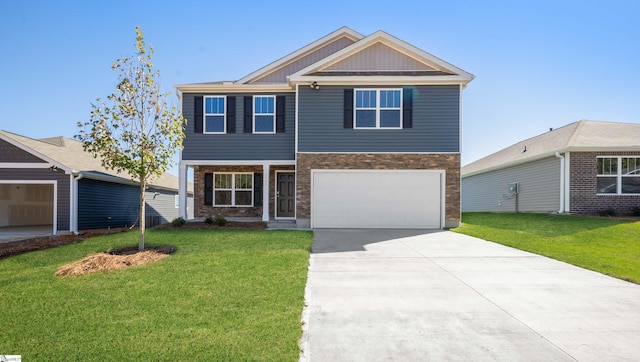 view of front of property featuring a front yard and a garage