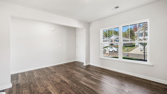 empty room featuring dark hardwood / wood-style floors