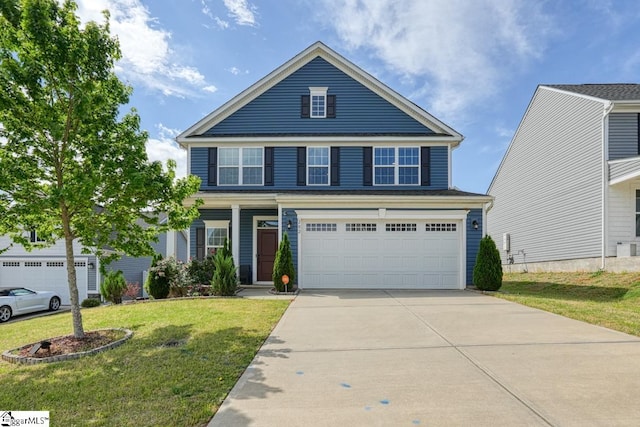 view of front of home featuring a garage and a front yard