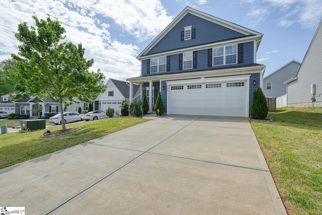 view of front of home with a garage and a front yard