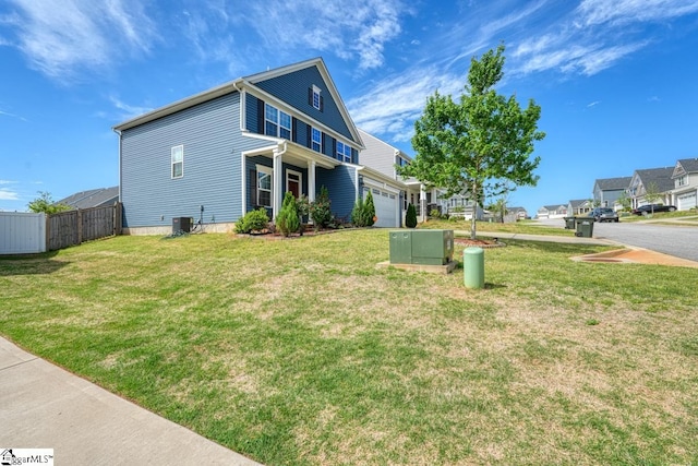 view of front of home with a front lawn and a garage