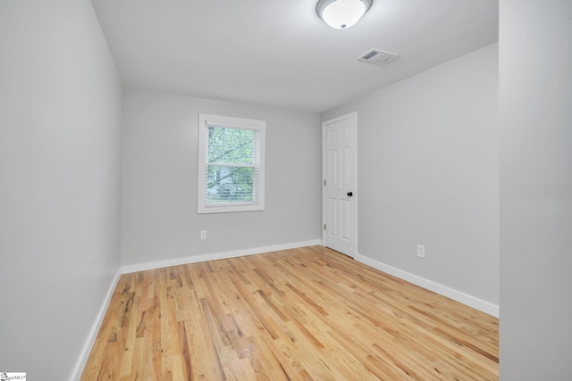 empty room with light wood-type flooring