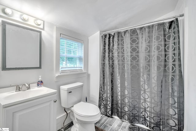 bathroom featuring hardwood / wood-style floors, toilet, and vanity