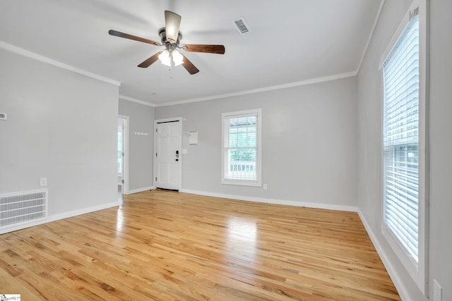 unfurnished room with ceiling fan, ornamental molding, and light hardwood / wood-style floors