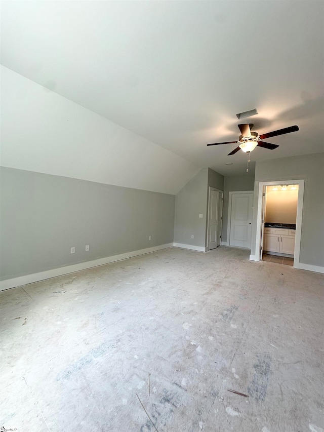 bonus room featuring baseboards, ceiling fan, and vaulted ceiling