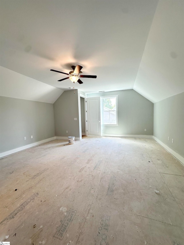 bonus room featuring baseboards, lofted ceiling, and ceiling fan