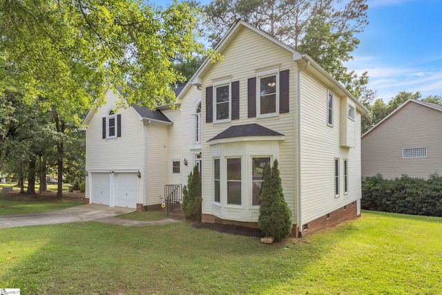 view of front of home featuring a garage and a front yard