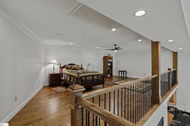 bedroom with crown molding and hardwood / wood-style floors