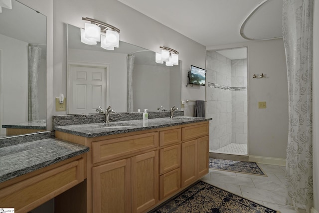 bathroom with walk in shower, tile flooring, dual sinks, and vanity with extensive cabinet space