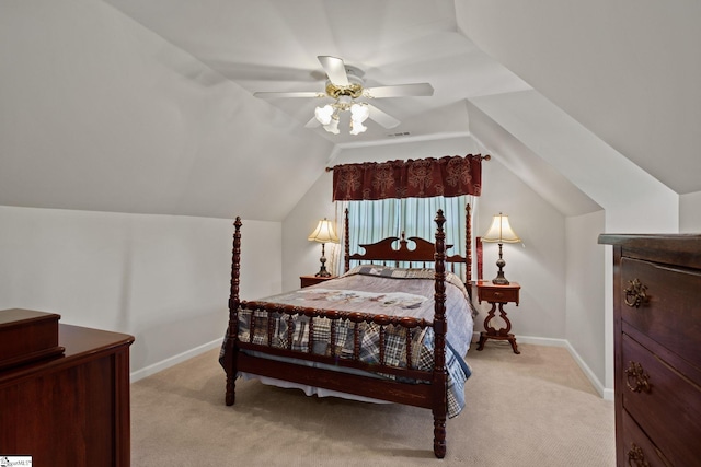 carpeted bedroom featuring ceiling fan and vaulted ceiling