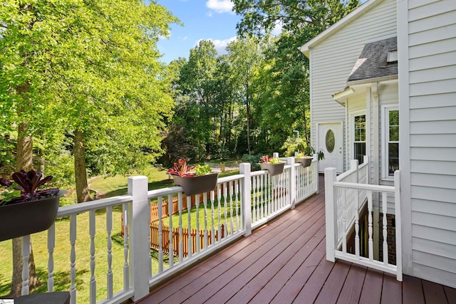 wooden deck with a lawn