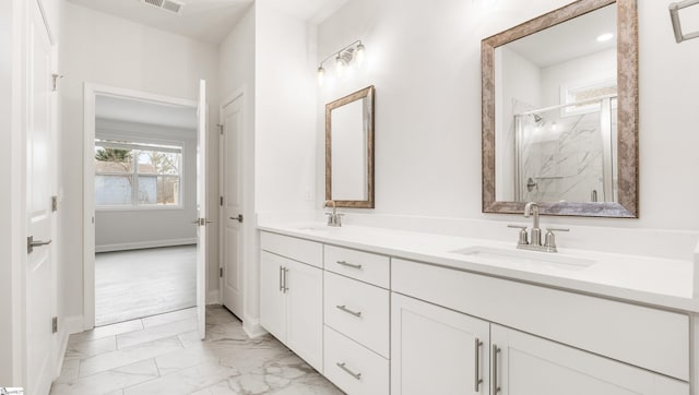 bathroom with vanity and a shower with shower door