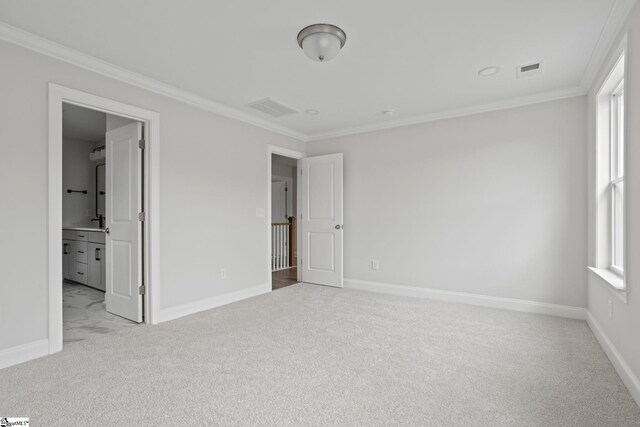 unfurnished bedroom with multiple windows, ornamental molding, and light colored carpet