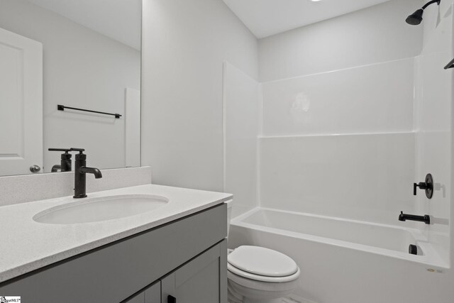 full bathroom with vanity, tub / shower combination, and toilet