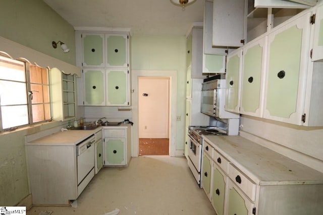 kitchen featuring white cabinets and white appliances