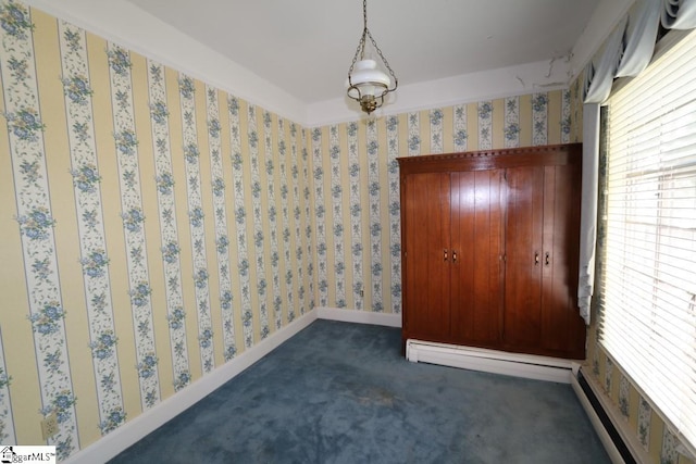 carpeted spare room featuring plenty of natural light