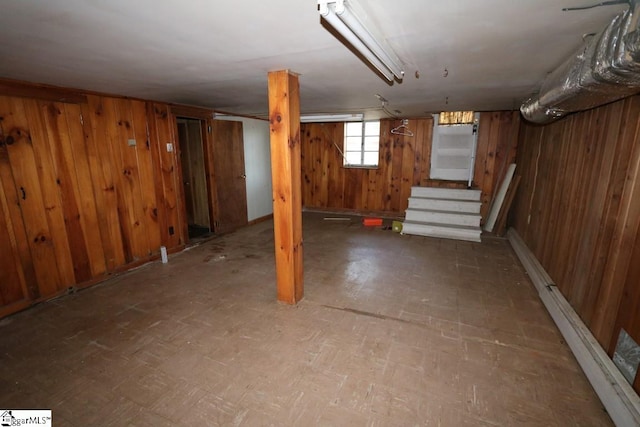 basement with wood walls