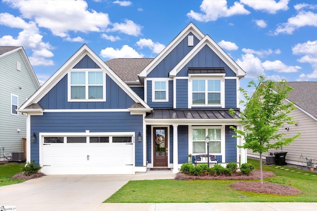 craftsman-style house with a front yard, a garage, and central AC unit