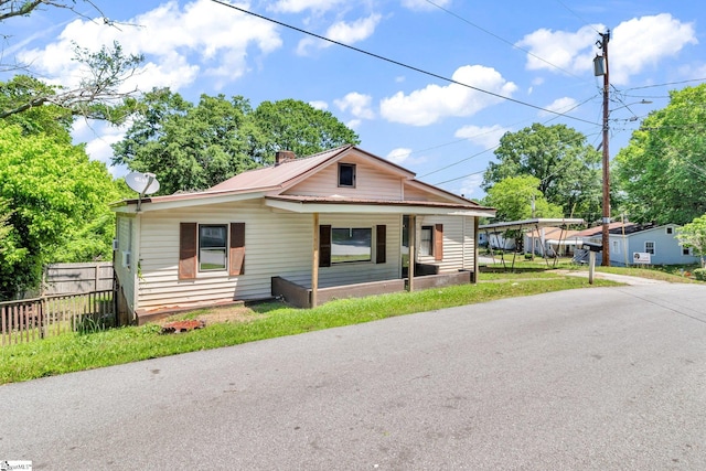 bungalow-style house with a front yard