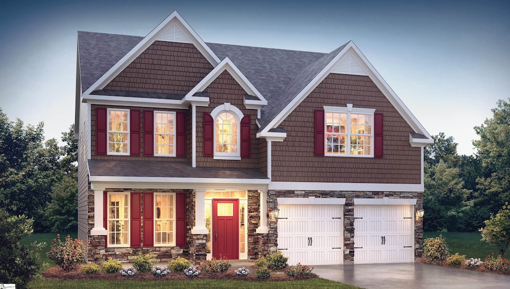 craftsman inspired home with a garage