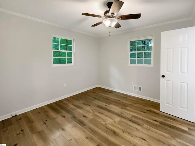 unfurnished room featuring ornamental molding, wood-type flooring, and ceiling fan