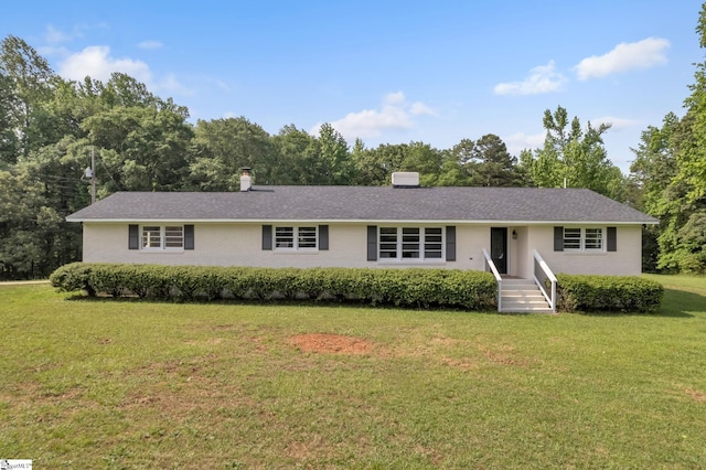 single story home featuring a front lawn