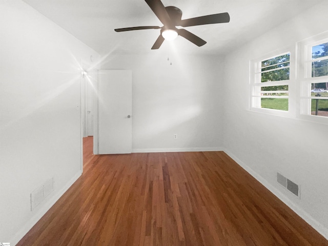 spare room with wood-type flooring and ceiling fan