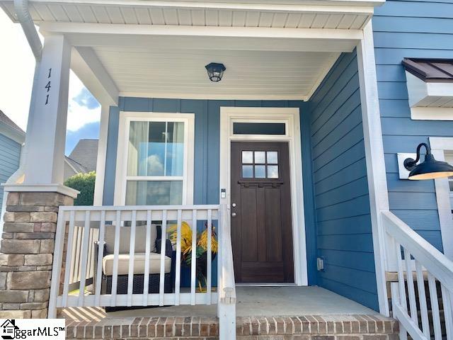 doorway to property with a porch