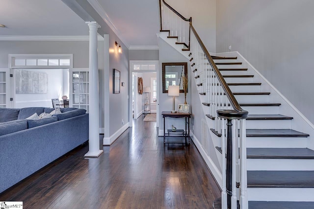 staircase with crown molding, dark wood-type flooring, and decorative columns