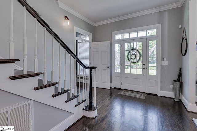 entryway with dark wood-type flooring and crown molding