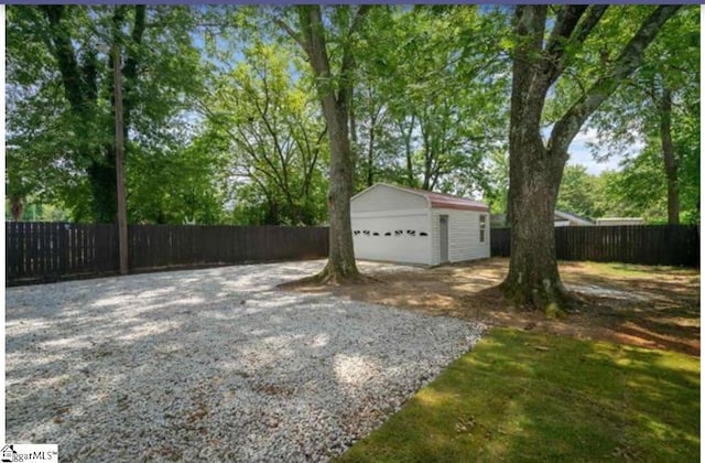 exterior space featuring a garage and an outdoor structure