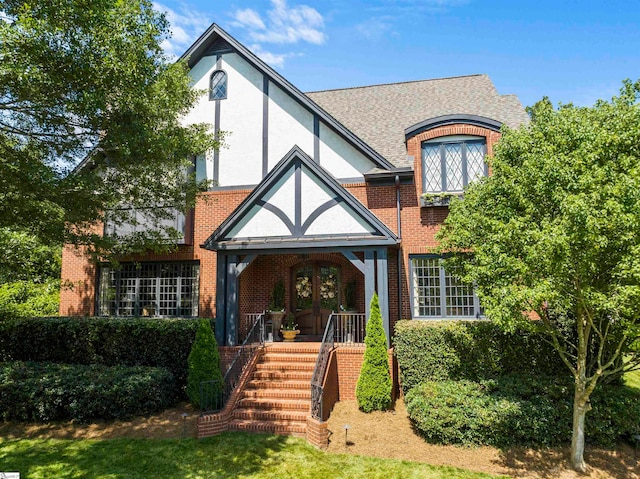 english style home with french doors