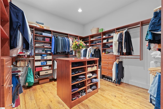 walk in closet featuring light hardwood / wood-style flooring