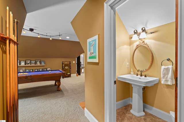 rec room with rail lighting, light colored carpet, lofted ceiling, and billiards