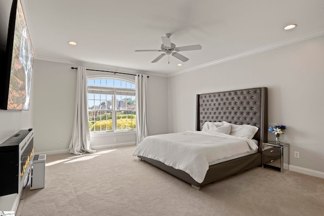 carpeted bedroom featuring a ceiling fan, baseboards, crown molding, and recessed lighting