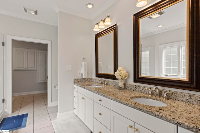 bathroom featuring ornamental molding, a sink, visible vents, and tile patterned floors