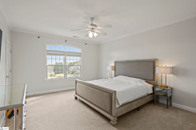 carpeted bedroom with a ceiling fan, visible vents, crown molding, and baseboards