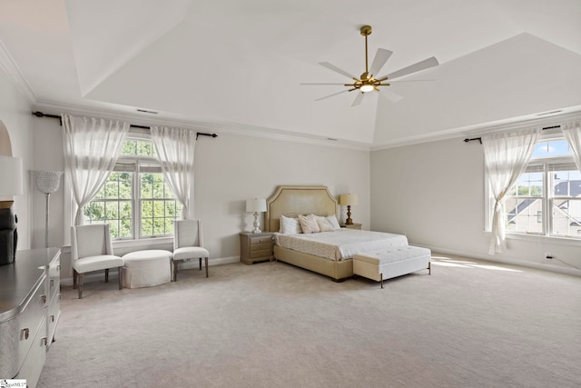 bedroom featuring crown molding, light carpet, vaulted ceiling, ceiling fan, and baseboards