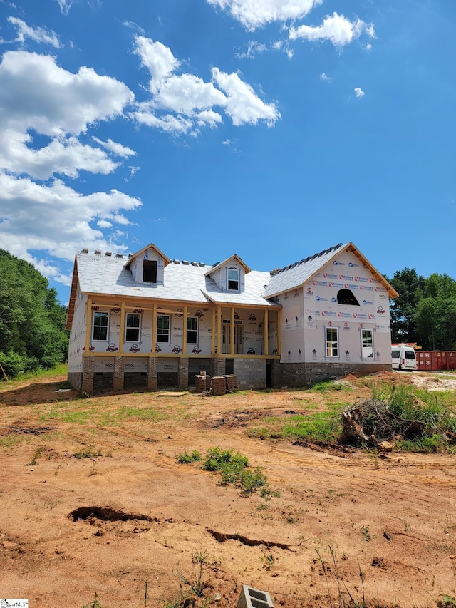 unfinished property featuring a porch