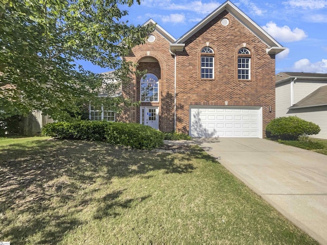 view of front facade featuring a garage and a front lawn