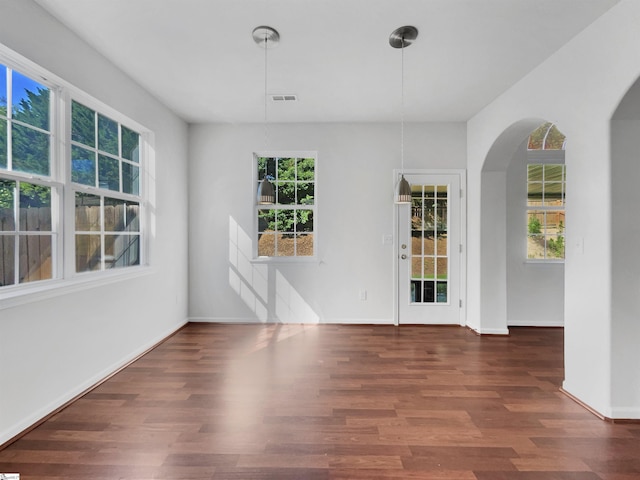 unfurnished room featuring dark wood-type flooring