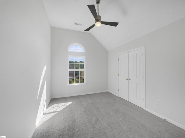 interior space featuring ceiling fan and vaulted ceiling